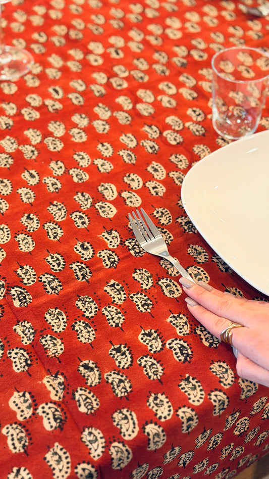 Hand-printed brick red and cream block print cotton tablecloth 150x220cm (60x87 inches): geometric stylized pattern with intricate floral cream border.