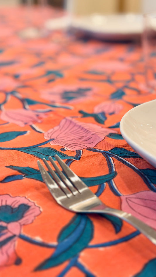 Hand-printed coral orange and pink block print cotton tablecloth 150x220cm (60x87 inches): vibrant large floral pattern with contrasting blue border.