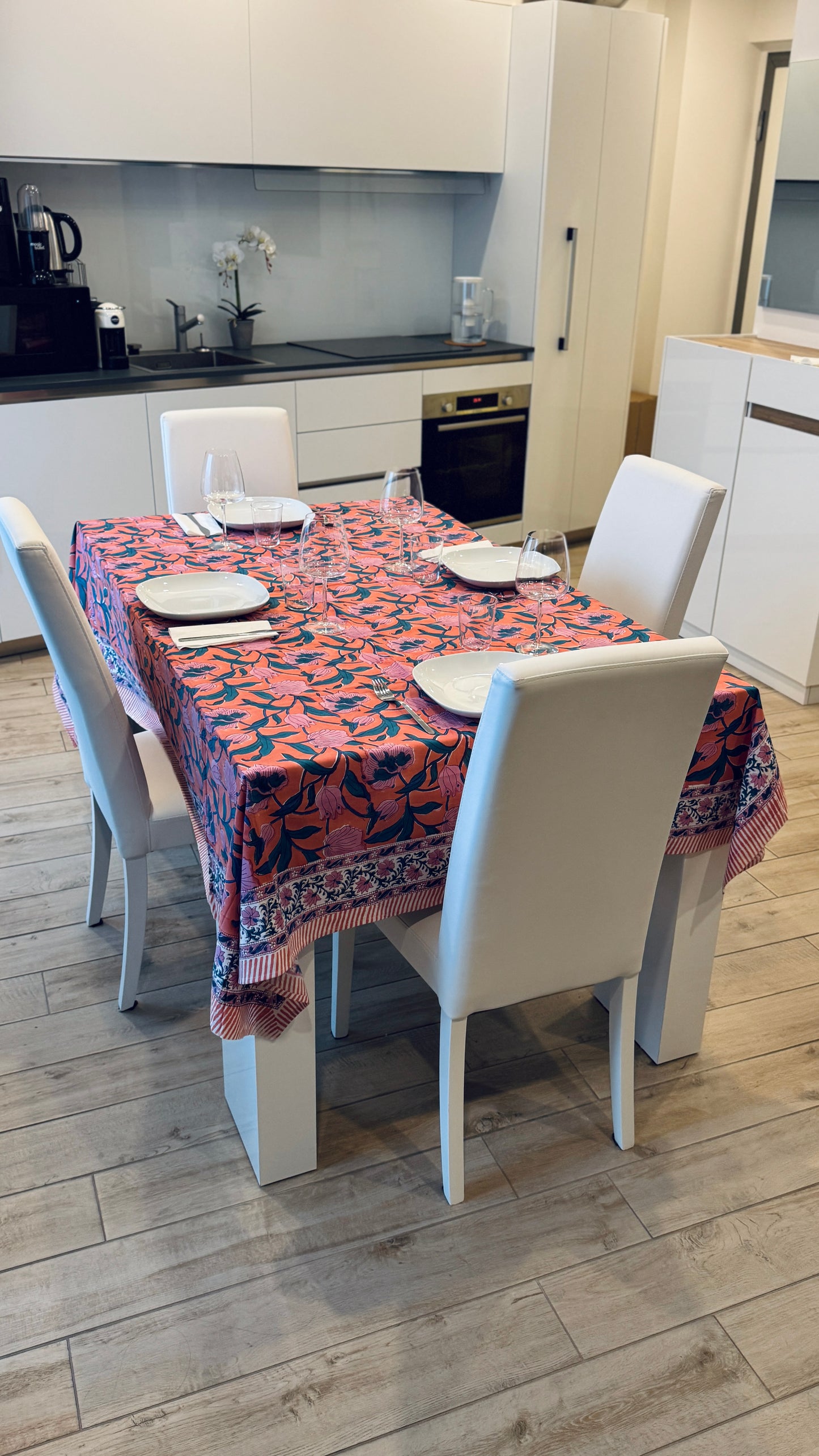 Hand-printed coral orange and pink block print cotton tablecloth 150x220cm (60x87 inches): vibrant large floral pattern with contrasting blue border.