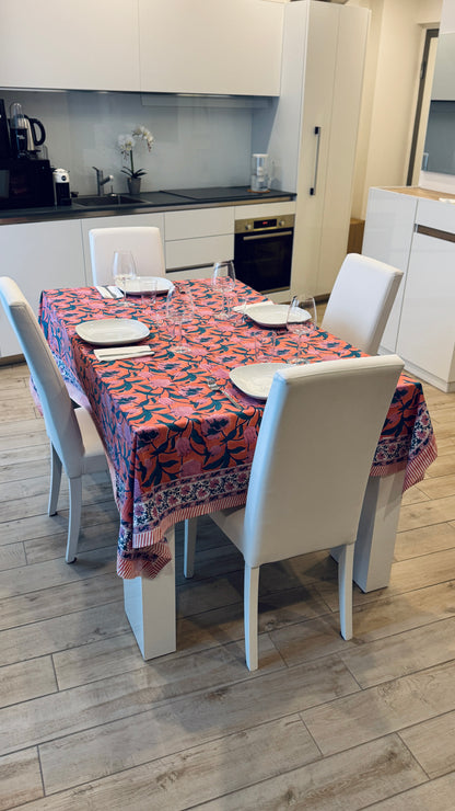 Hand-printed coral orange and pink block print cotton tablecloth 150x220cm (60x87 inches): vibrant large floral pattern with contrasting blue border.