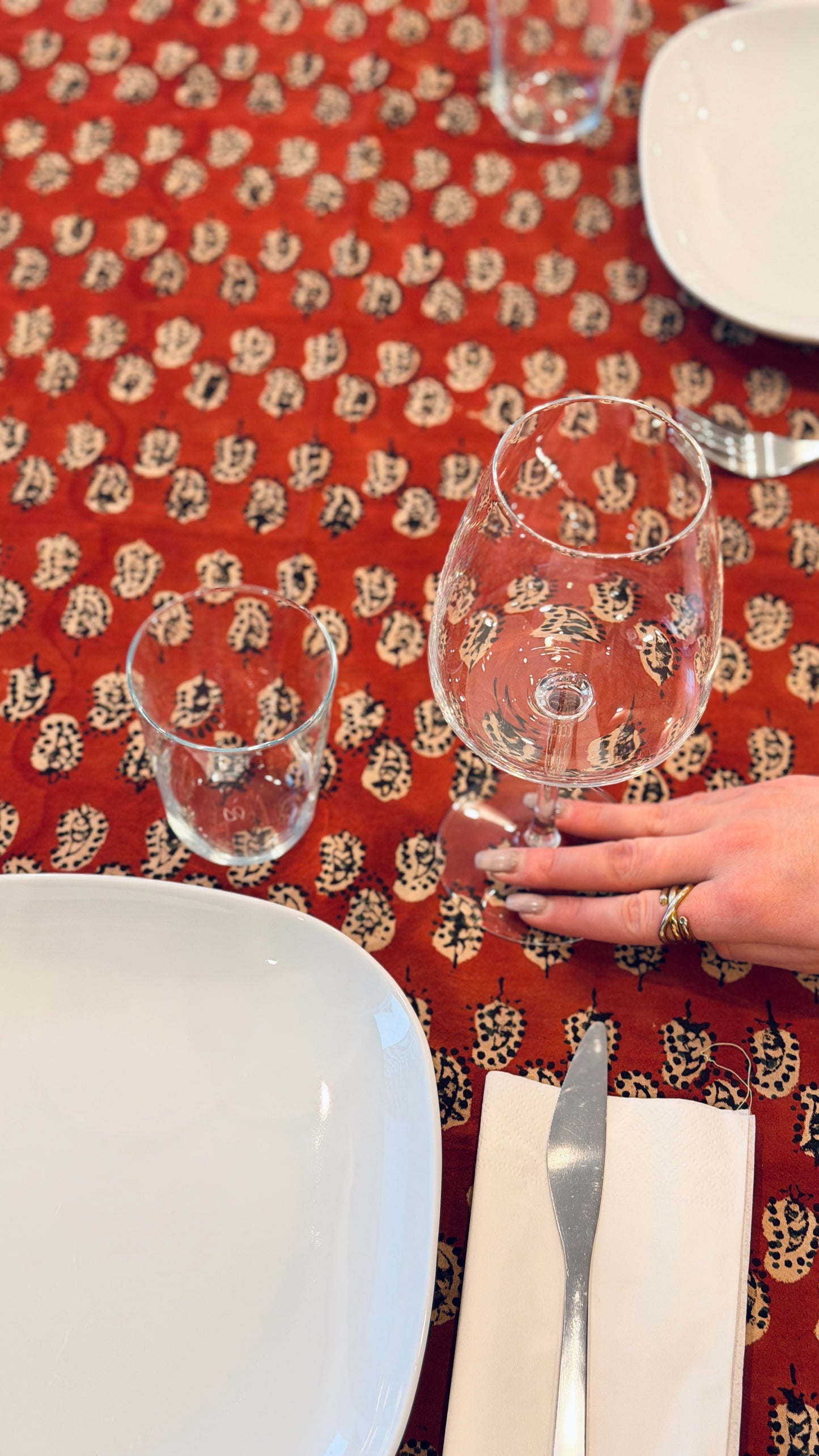 Hand-printed brick red and cream block print cotton tablecloth 150x220cm (60x87 inches): geometric stylized pattern with intricate floral cream border.