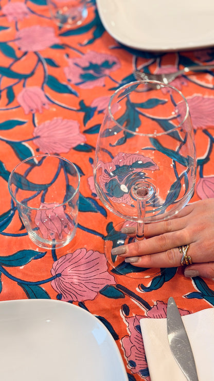 Hand-printed coral orange and pink block print cotton tablecloth 150x220cm (60x87 inches): vibrant large floral pattern with contrasting blue border.