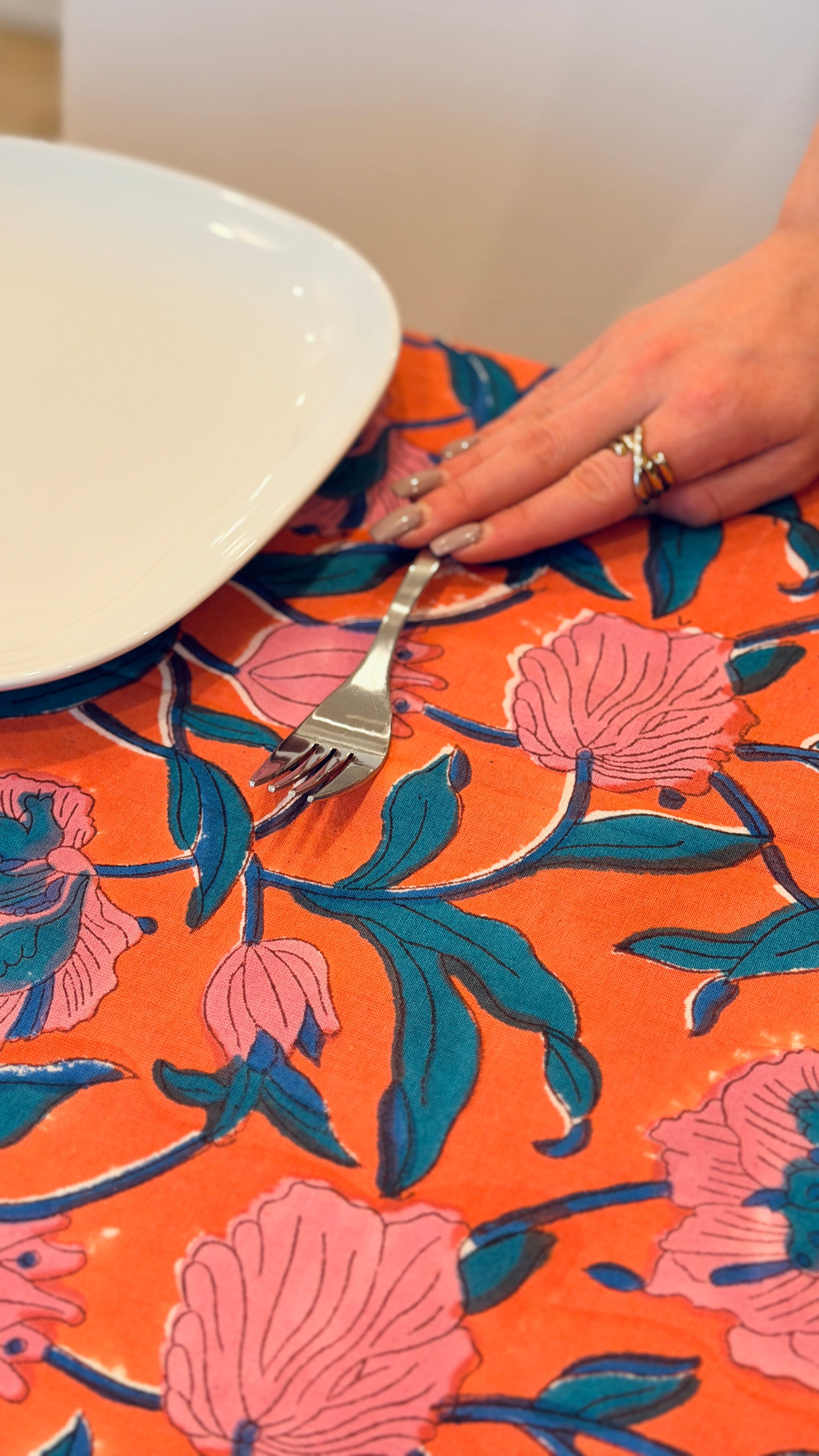 Hand-printed coral orange and pink block print cotton tablecloth 150x220cm (60x87 inches): vibrant large floral pattern with contrasting blue border.