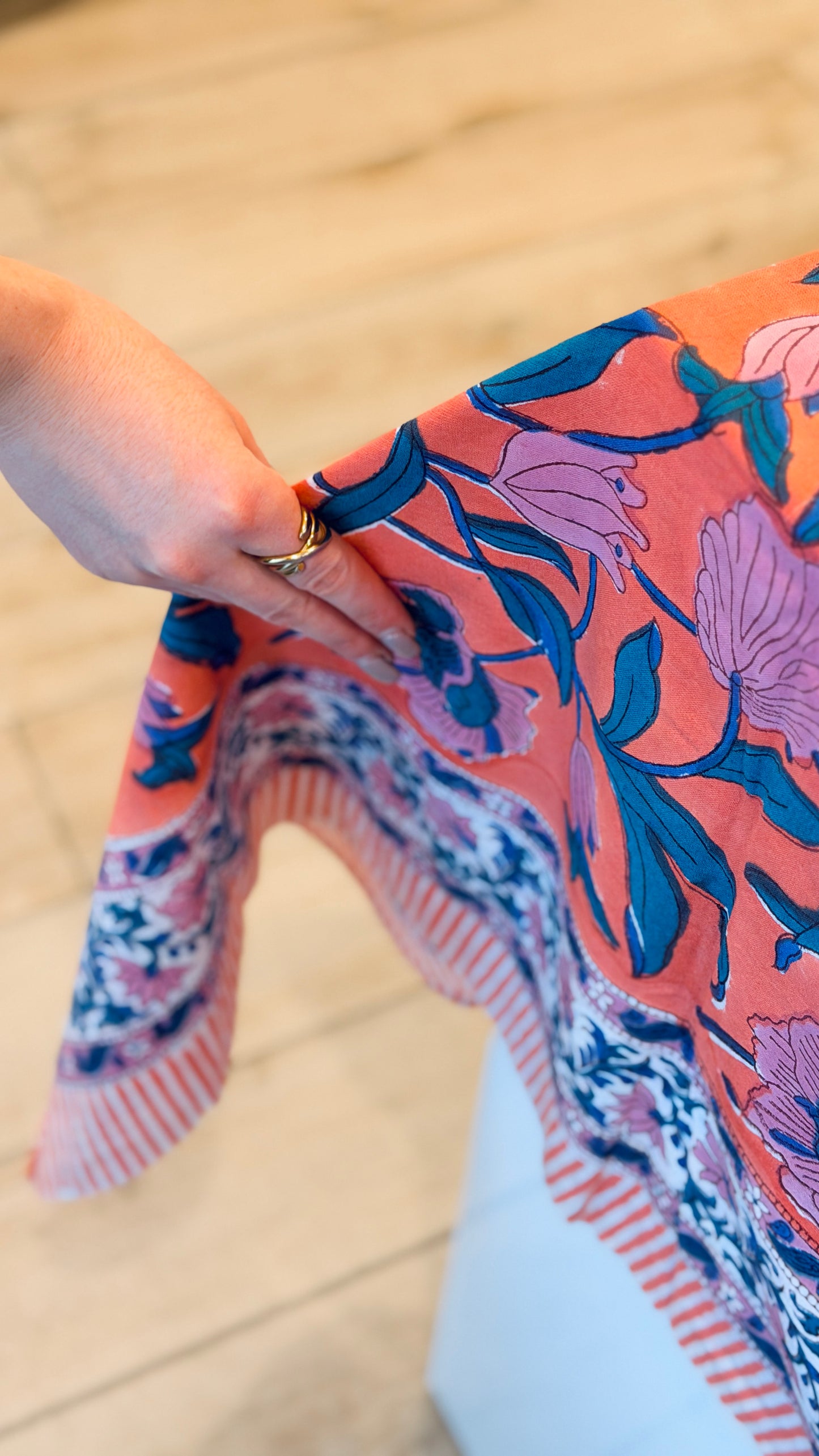 Hand-printed coral orange and pink block print cotton tablecloth 150x220cm (60x87 inches): vibrant large floral pattern with contrasting blue border.