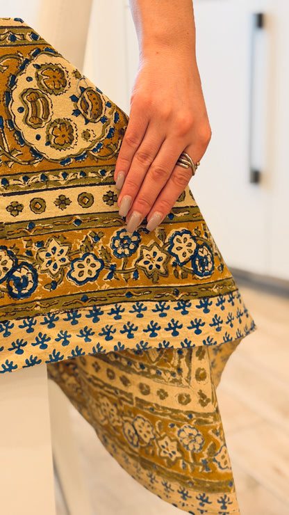 Hand-printed ivory block print cotton tablecloth 150x220cm (60x87 inches): dense floral pattern in green, indigo blue, and mustard yellow with a trimmed border.